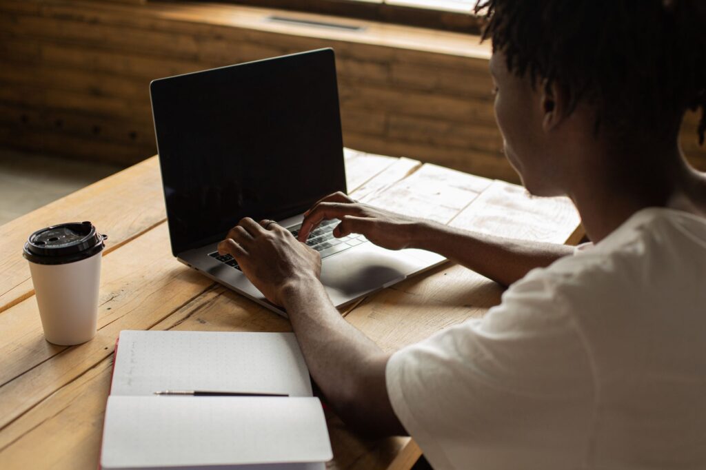 A person working online on a laptop