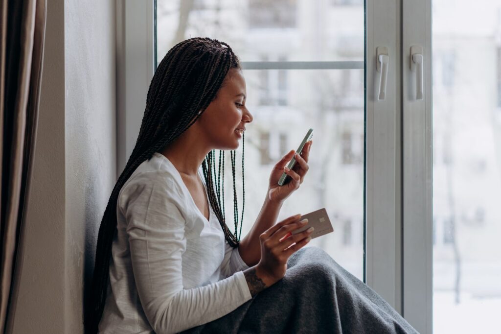 A person moving money into a savings account via a banking app