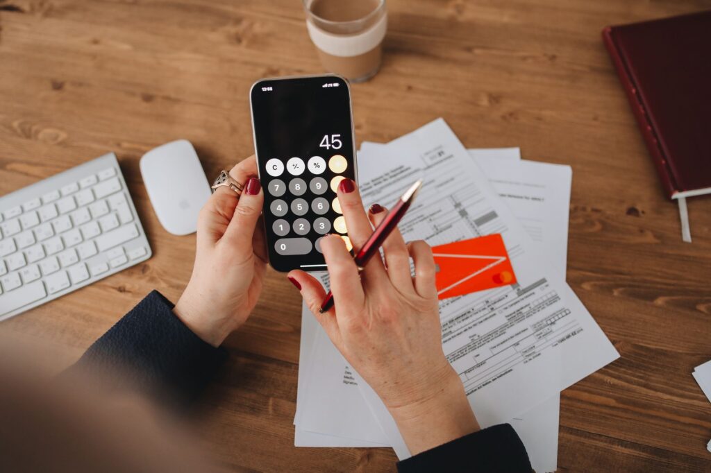 reviewing personal budget on smartphone app