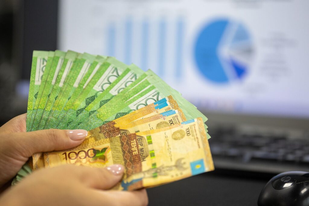 Laptop screen showing a savings account balance and interest growth