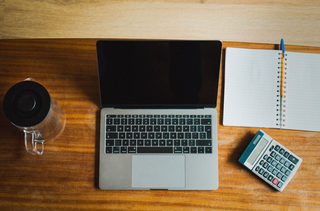 Person reviewing their credit score report on a laptop