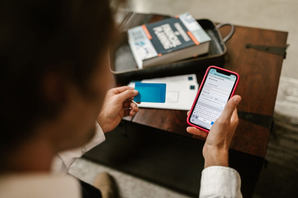 Person checking their credit card balance on a banking app