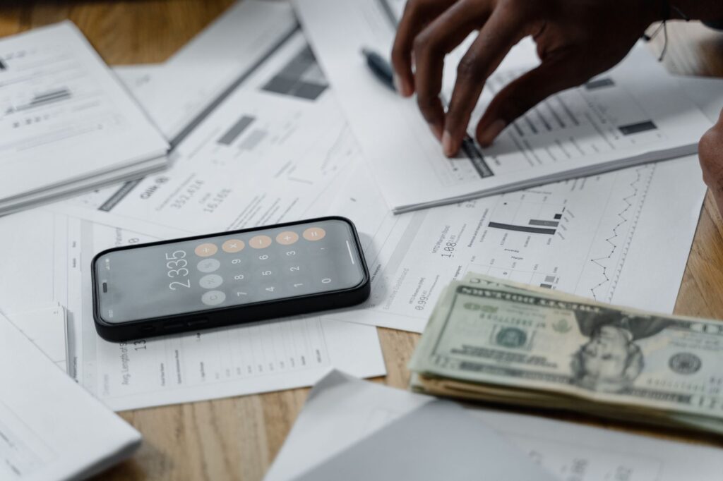 person on the phone discussing a hardship plan with a lender