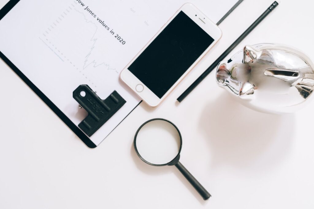 Retirement savings documents and piggy bank on a desk