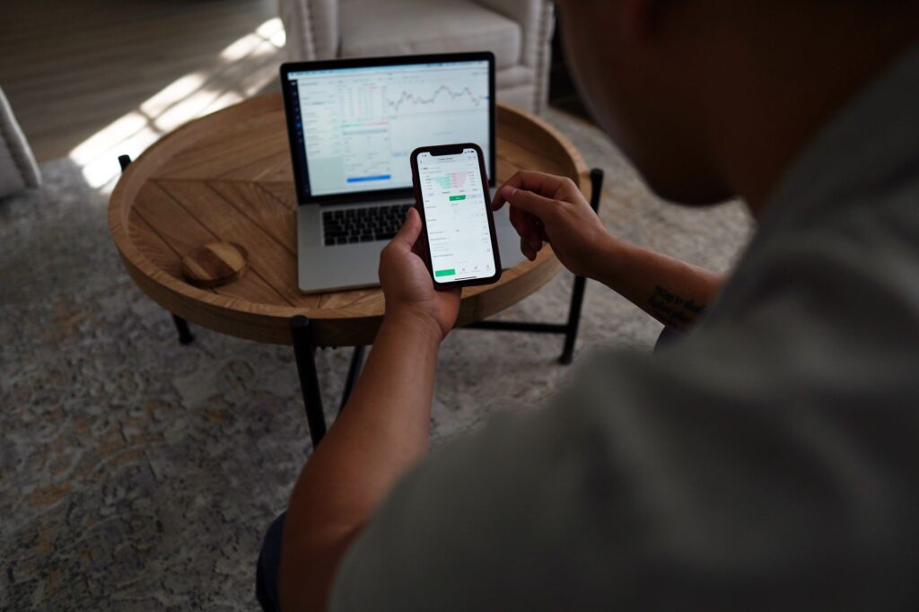Person reviewing an investment brokerage account on a laptop