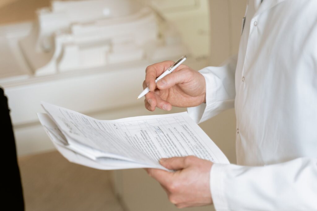 Person reviewing FSA healthcare benefits paperwork at a desk