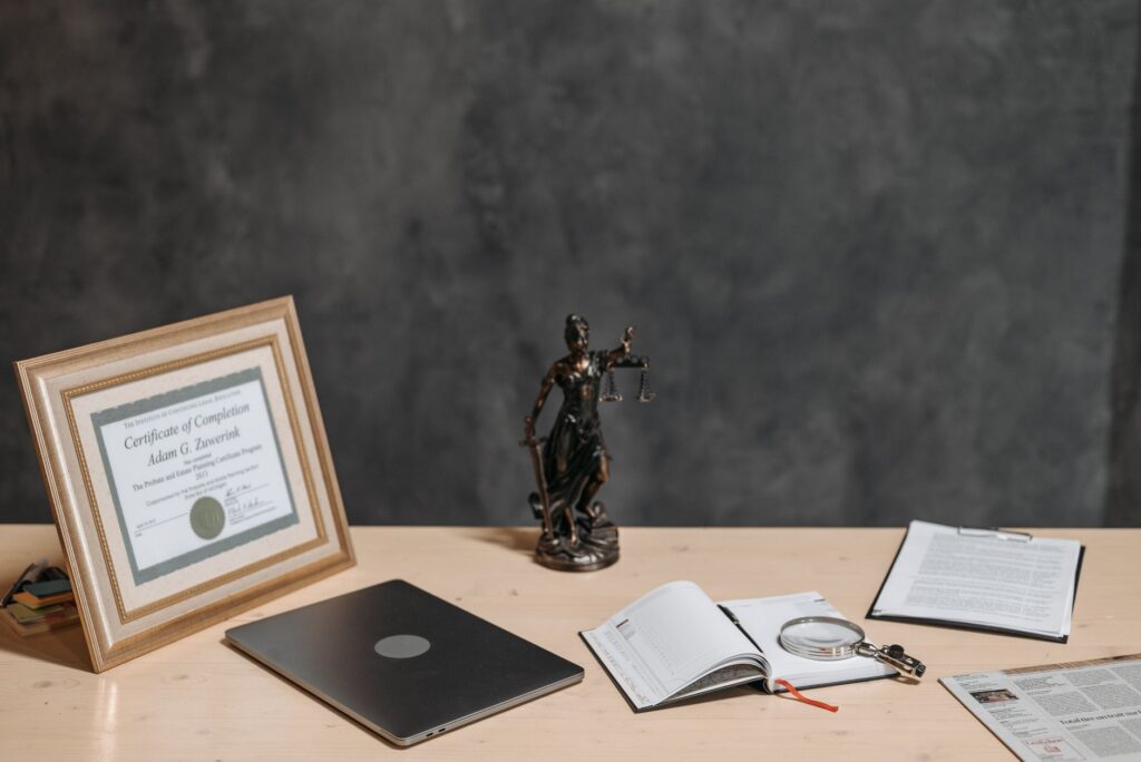 Paper bond certificate next to a calculator and financial statements