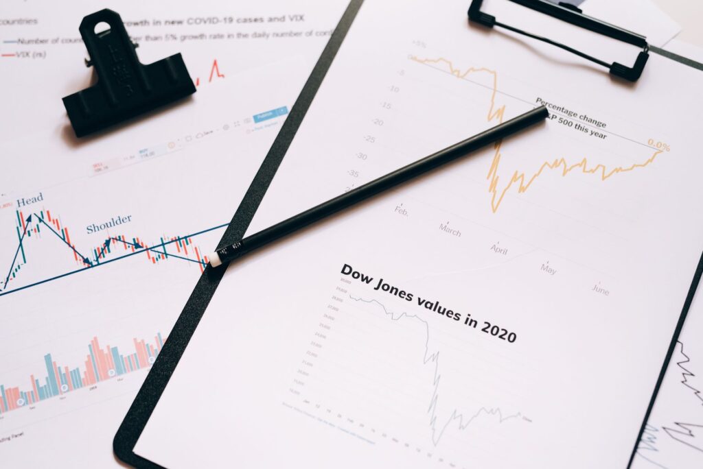Financial charts and investment documents on a desk, representing mutual fund research