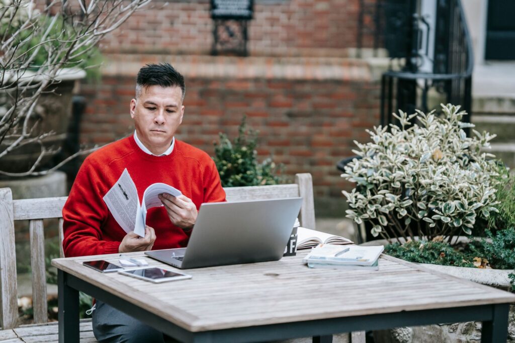 Person checking retirement account balance and contribution split on a laptop