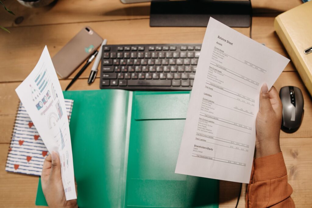Person reviewing a retirement account statement at a desk