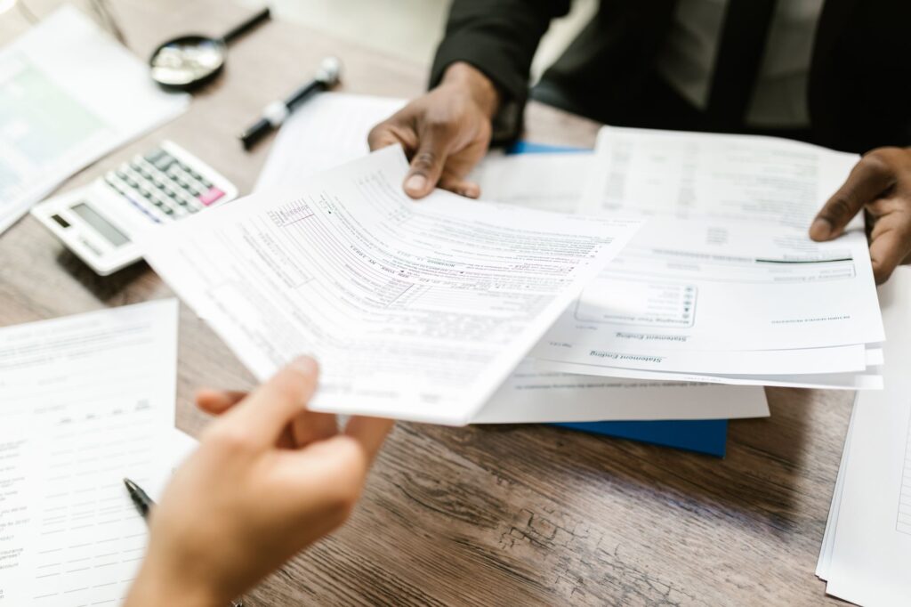 Insurance paperwork and calculator on a desk