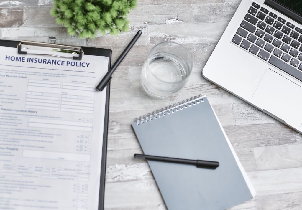 Person comparing term life and whole life insurance policy documents